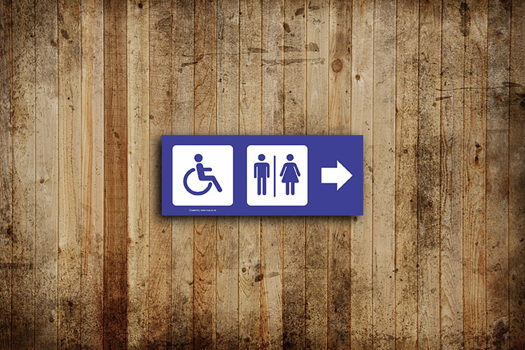 restroom sign with images and direction